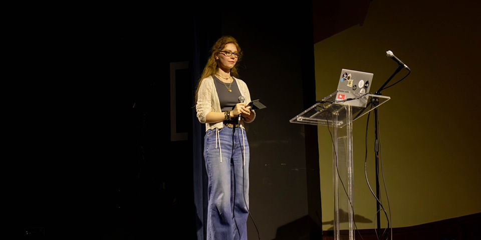 Oksana is presenting her project to an expert jury.